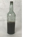 Flaska innehållande Sargassogräs